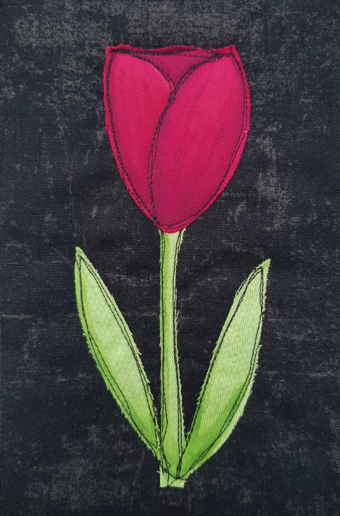 Applique tulip on a black background